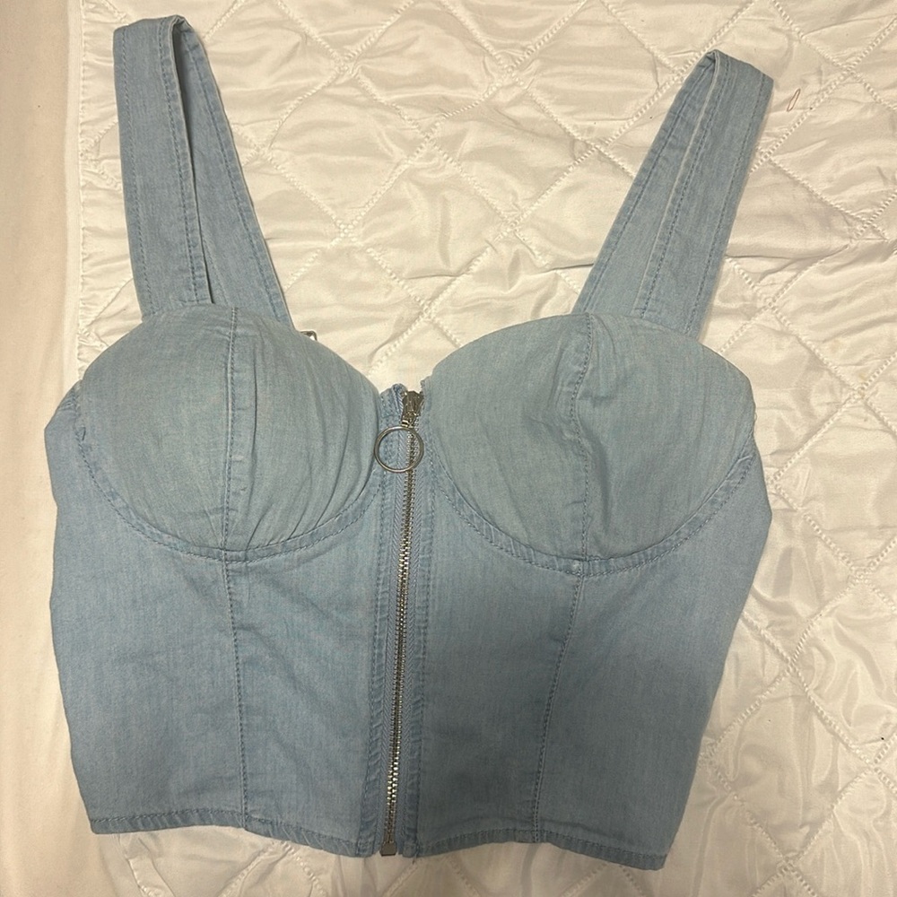 This is a blue crop top zip up kind of corset top.